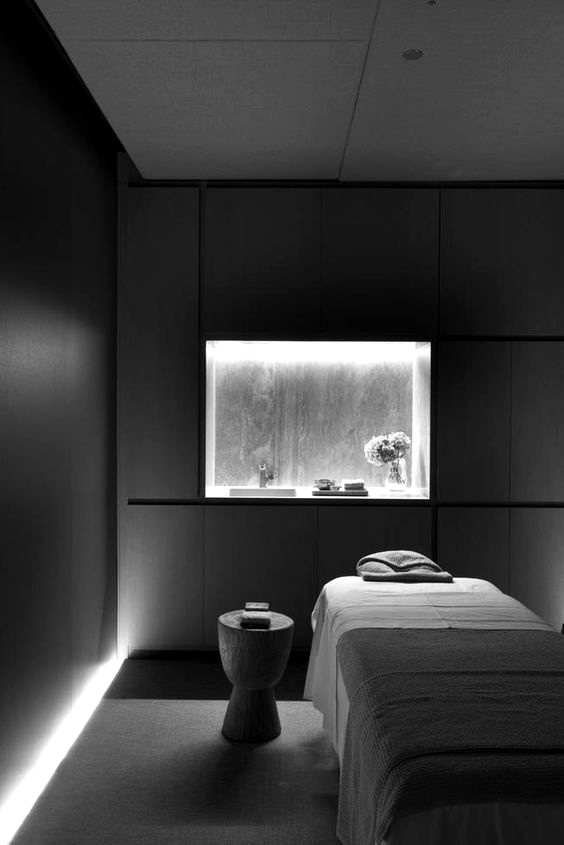 A dimly lit modern spa treatment room